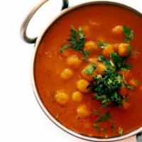 Chana Masala · A combination of chick peas, onions and tomatoes cooked in a rich sauce. Full size served wi...