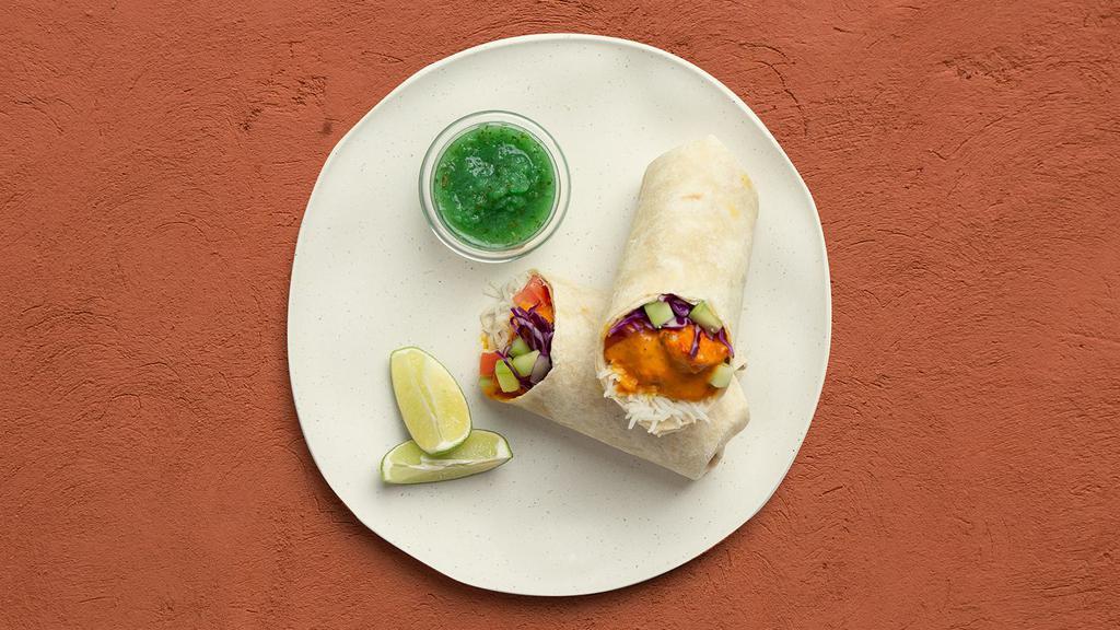 Chicken Tikka Masala Burrito · Buttery chicken tikka masala with basmati rice, diced cucumber and tomato, shredded cabbage, and mint chutney in a naan wrap.