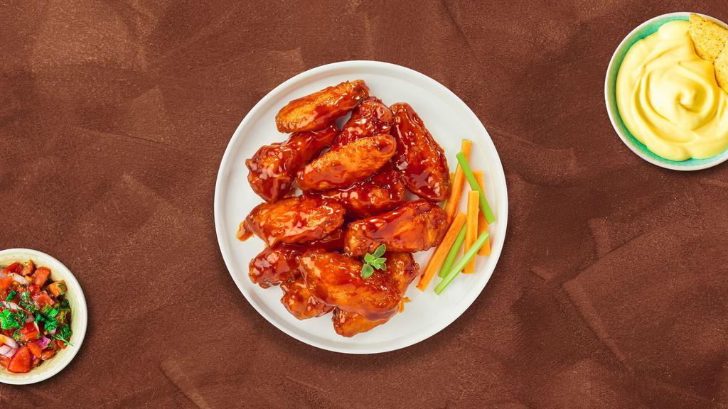 Blazing Buffalo Chicken Wings · Fresh chicken wings breaded, fried until golden brown, and tossed in buffalo sauce. Served with a side of celery, or carrots and ranch or bleu cheese.