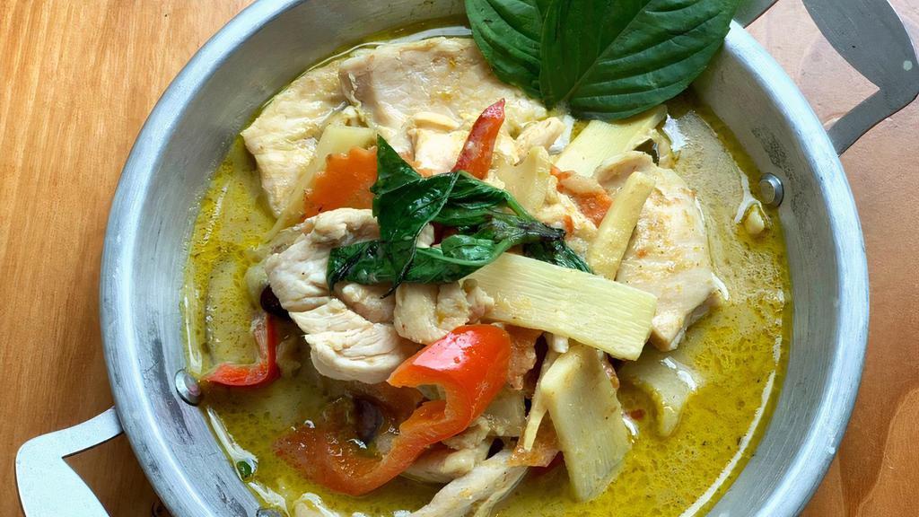 Green Curry · Spicy. Green curry paste, coconut milk, bamboo shoots, bell peppers, eggplants carrot and basil leaves.
