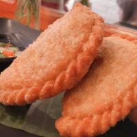 Curry Puffs · Siamese pastry stuffed with chicken, potatoes and curry.