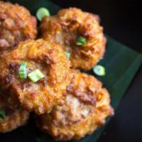 Golden Fritters · Crispy chicken and shrimp dumpling with sweet chili sauce.