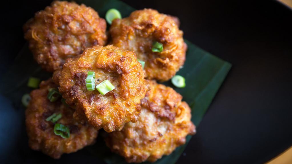 Golden Fritters · Crispy chicken and shrimp dumpling with sweet chili sauce.