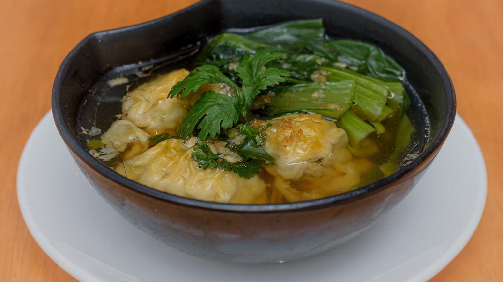 Wonton Soup · Chicken and shrimp wonton with vegetable broth and baby bok choy.
