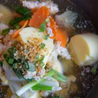 Thip Osha Soup · Minced marinated chicken, napa, carrot, scallion and egg tofu.