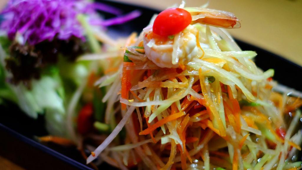 Seafood Papaya Salad · No peanut. Shrimp, squid, mussels, green papaya, carrot, tomato, string bean and spicy lime dressing.