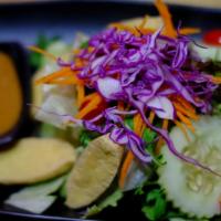 Garden Salad · Mixed fresh green vegetables served with peanut sauce dressing.