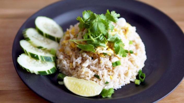 Thai Fried Rice · Authentic Thai fried rice, egg, onion, tomatoes, scallion and carrot.