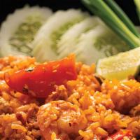 Tom Yum Fried Rice · Jasmine rice, egg, chili paste, red onion, lemongrass, galangal, and scallion.