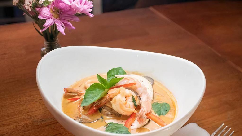 Red Curry · Spicy. Red curry paste, coconut milk, bamboo shoots, bell peppers, eggplants and basil leaves.