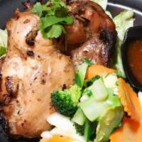 Gai Yang · Grilled marinated chicken thigh with 
steamed vegetable served sweet chili sauce.