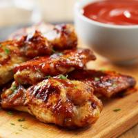 Shack'S Bbq Wings · Oven baked and crisp bone-in chicken wings smothered in sweet BBQ sauce.