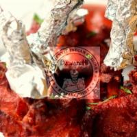Chicken Lollipops (4) · Chicken drumsticks marinated in spices, coated in zesty batter, deep fried & served with hot...