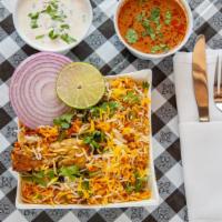 Hyderabadi Chicken Dum Biryani (Family Pack) · Chicken cooked in basmati rice with special herbs and spices.