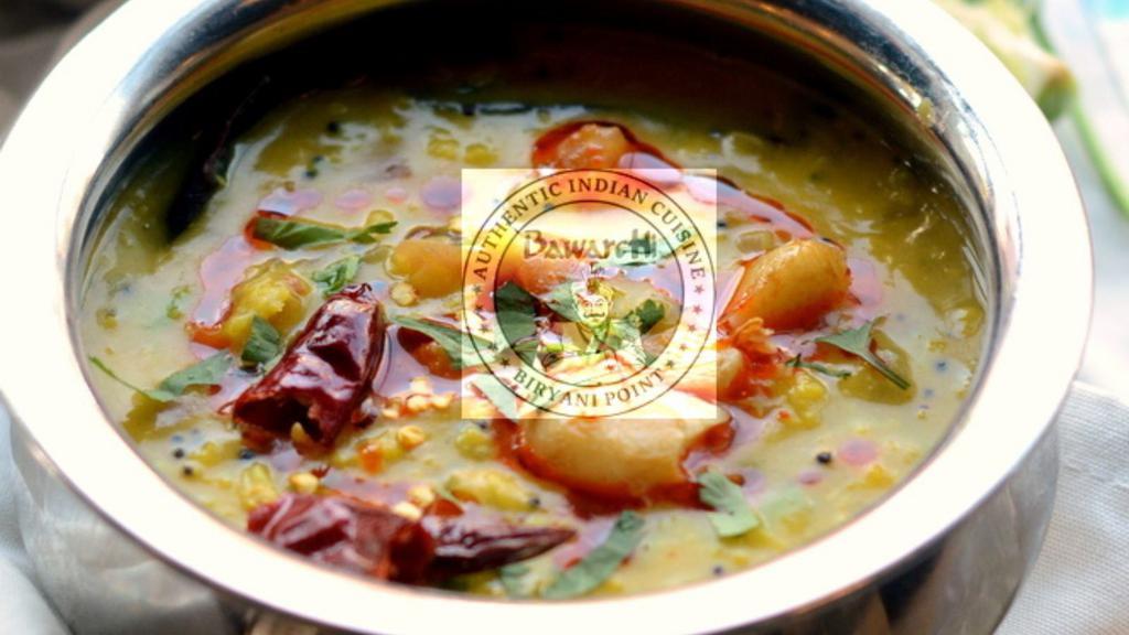 Dal Tadka · Yellow lentils sautéed with onions, tomatoes, and spices.