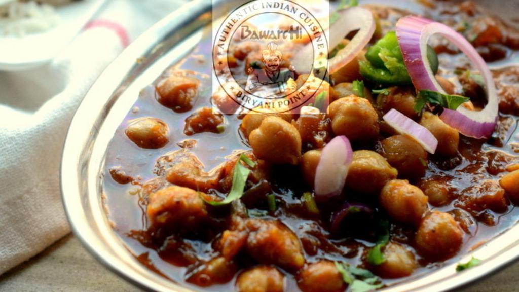 Channa Masala · Garbanzo beans cooked with spices, onion, and tomato gravy.