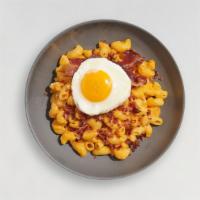 Breakfast For Dinner Mac · The classic creamy mac and cheese cooked with bacon and topped with a fried egg.