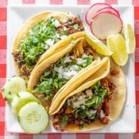 Pollo Tacos · Shredard chicken with a soft corn tortilla topped with cilantro and onions. You have the cho...