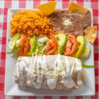 Pollo Burrito · Chicken, flour tortilla topped with refried beans lettuce, cheddar cheese, avocado, lettuce,...