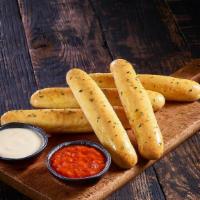 Breadsticks With Dipping Sauces · Five breadsticks with Parmesan and Tomato Basil dipping sauces.