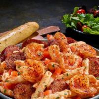 Blackened Shrimp & Sausage · Penne pasta tossed with a creamy tomato and alfredo sauce and finished with diced tomatoes. ...
