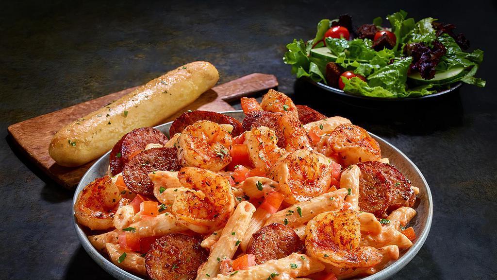 Blackened Shrimp & Sausage · Penne pasta tossed with a creamy tomato and alfredo sauce and finished with diced tomatoes.  Served with 4 Breadsticks.