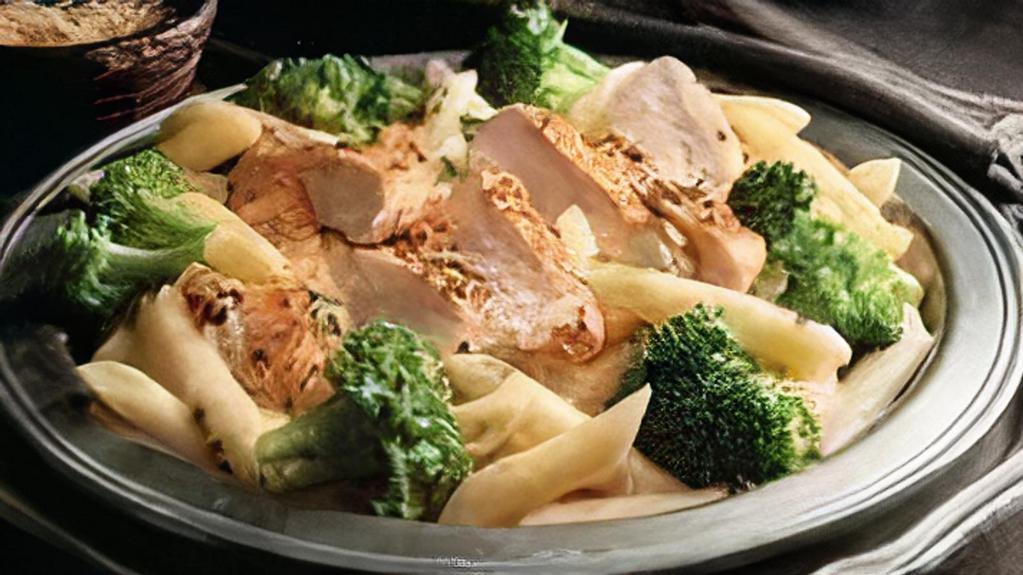 Chicken & Broccoli Pasta · Seasoned chicken and fresh broccoli over penne pasta in Parmesan cream.  Served with 4 Breadsticks.