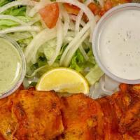 Fish Tikka · Salmon marinated and grilled to perfection in a tandoor oven.