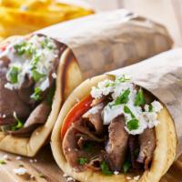 Gyro Sandwich · Beef and Lamb Gyro with Seasonings and Grilled to Perfection. Filled with Chopped Salad and ...