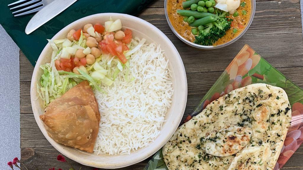 Vegetable Korma Platter · Mild Vegan Mixed Vegetable Coconut Korma Combo Meal with Samosa Appetizer, Salad, Steamed Basmati
Rice.