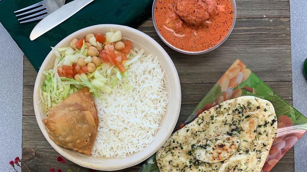 Chicken Tikka Masala Platter · India's Famous Chicken Tikka Masala Curry Combo Meal with Samosa Appetizer, Salad, Steamed Basmati
Rice