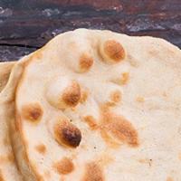 Roti · Whole wheat bread baked in clay oven pot (tandoor).