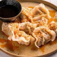 Garlic Pork Dumplings · Pork and chives dumplings with fried garlic and chili oil on top