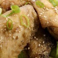 Hui’S Chicken Wing · Marinated fried chicken wings topped with sesame seeds