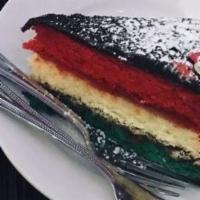 Italian Rainbow Cake · Three sponge cake layers filled with sweet raspberry jam and almond marzipan.