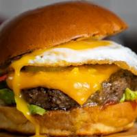 Brekkie Burger · American beef patty cooked medium and topped with bacon, fried egg, avocado, and your choice...