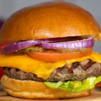 The Cheeser Burger · American Beef Patty topped with melted cheese, cooked medium served on a griddled bun, with ...