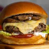 Fungi Fun Guy Burger · American beef patty cooked medium topped with mushrooms and melted cheese, served on a gridd...