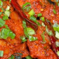 Chicken 65 · Spicy. Tender crispy chicken cooked with curry leaves, mustard and chili peppers.