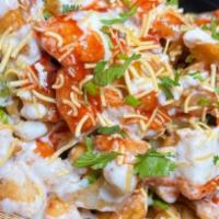 Papri Chaat · Homemade chips with chickpeas, potatoes, onions topped with yogurt, tamarind, and mint chutn...