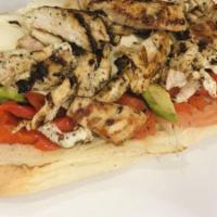 Chicken Philly Signature Sandwich · Marinated grilled chicken, melted American cheese, sauteed onions and peppers. Served on a t...