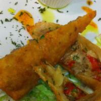 Cheese Steak Eggrolls · Juicy marinated steak, cheddar cheese, peppers and onions served with horseradish mustard sa...