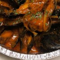 Steamed Mussels · With onions, garlic, bacon, shallots, tomatoes.