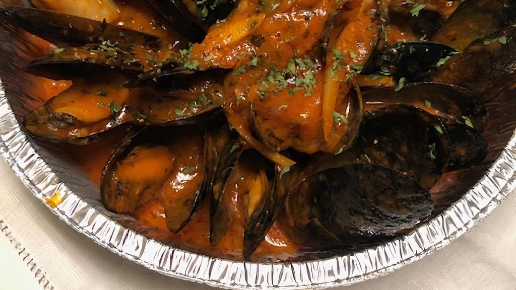 Steamed Mussels · With onions, garlic, bacon, shallots, tomatoes.