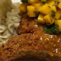 Stuffed Pork Chop · With spinach and mozzarella cheese over mashed potatoes and mango salsa
