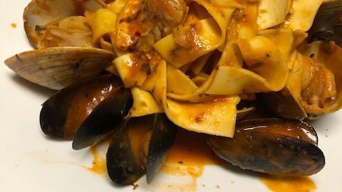 Pappardelle Fra Diavolo · clams, mussels, shrimp, bay scallops, calamari, onions, tomatoes in a zesty marinara sauce