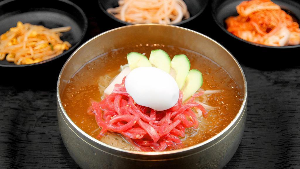 Yukhoe Mul Naengmyeon 육회물냉면 · Buckwheat noodles and marinated beef tartare in cold broth.