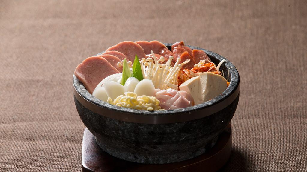 Budae-Jjigae 부대찌게 · Spicy. Spicy kimchi with ham and sausage stew.