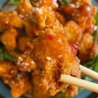 Karaage Chicken · Japanese style fried chicken served with a sweet and spicy
chili sauce.