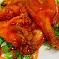 Thai Chicken Wings · Deep fried chicken wings marinated with Thai herbs and hot-spicy sauce. Served with sweet ch...